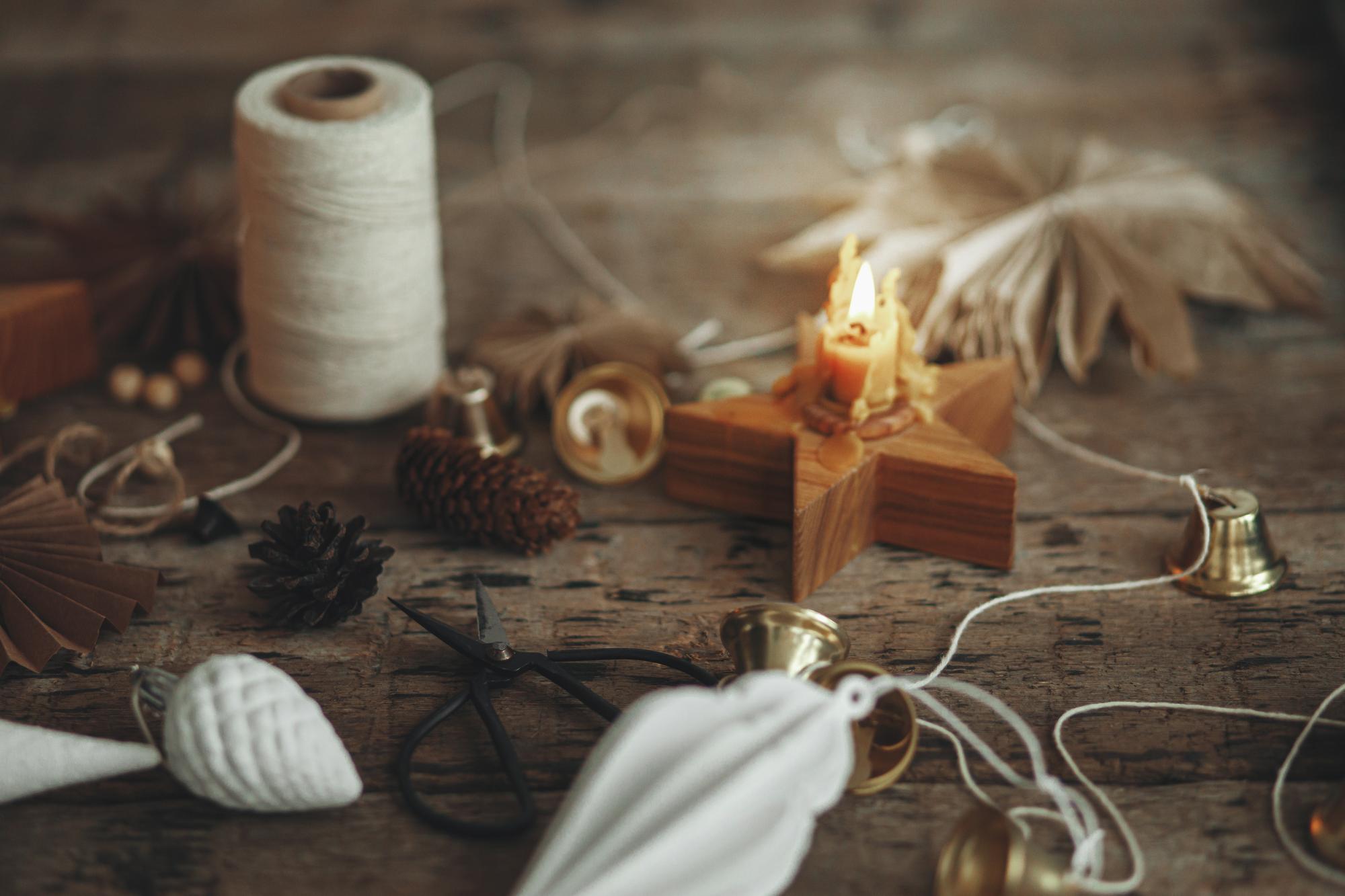 Artisan stitching embroidery in warm studio light